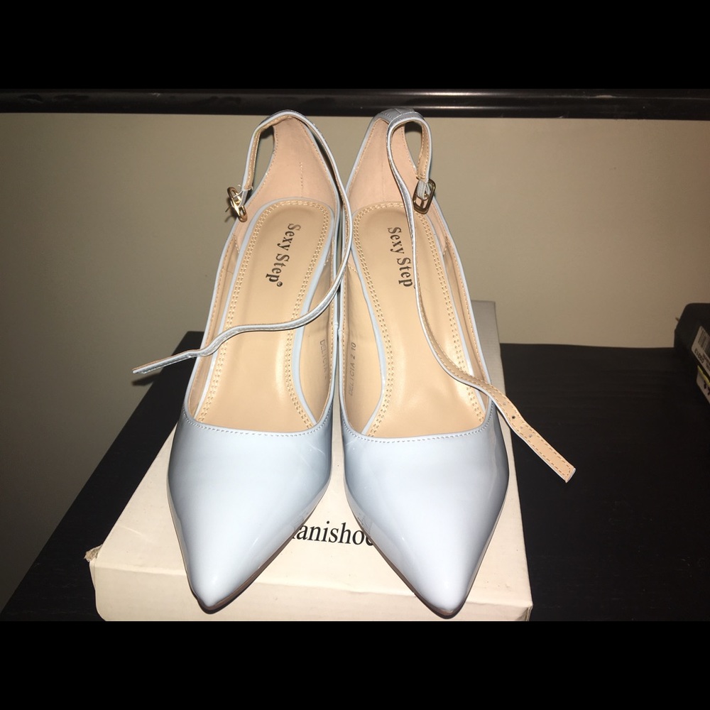 Brand new Light blue pumps .